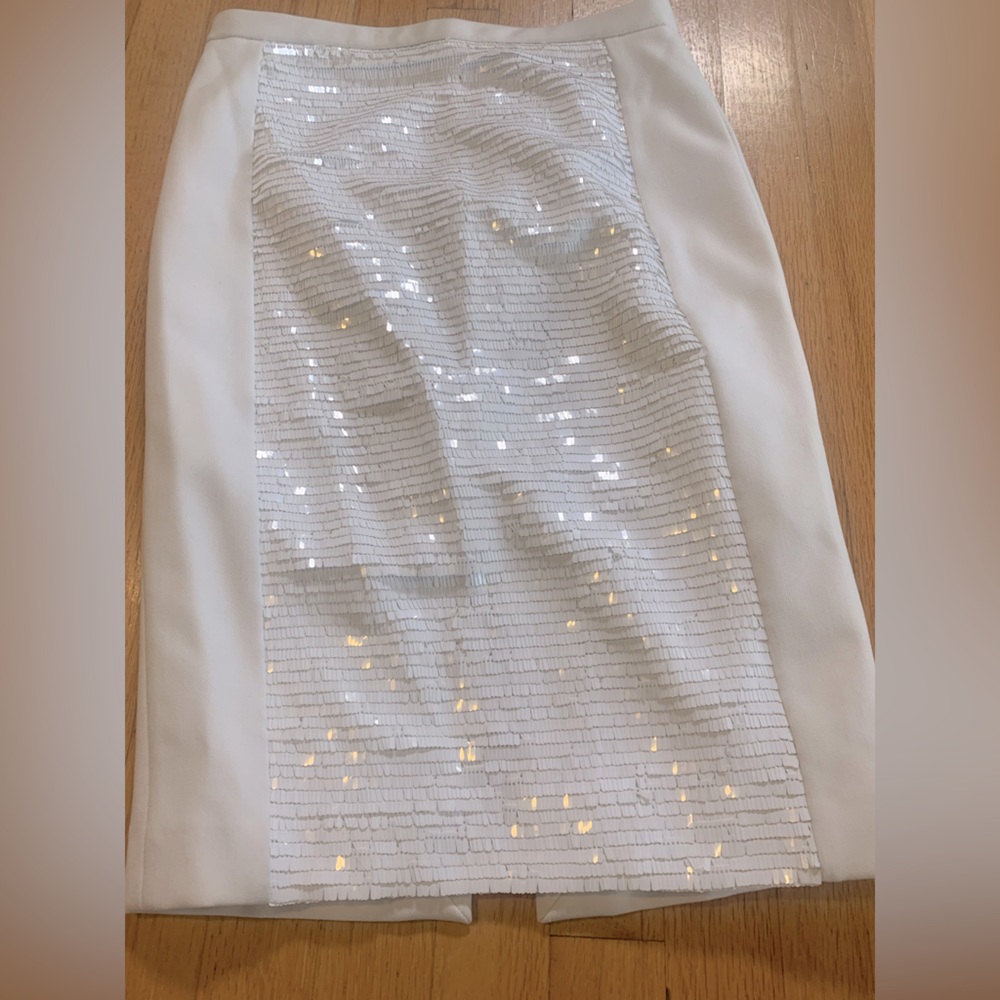 White skirt with sequins.